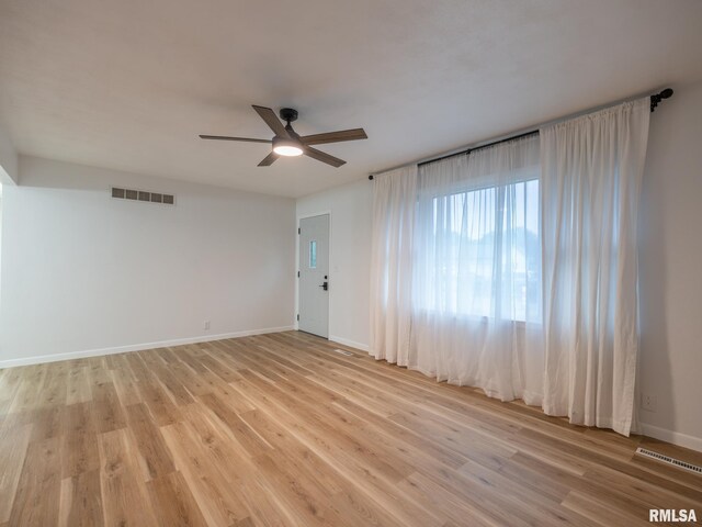 410 Stout Dr, Mackinaw, IL 61755 - spare room featuring a ceiling fan and light wood finished floors
