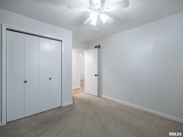 410 Stout Dr, Mackinaw, IL 61755 - unfurnished bedroom featuring carpet floors, a closet, and a ceiling fan