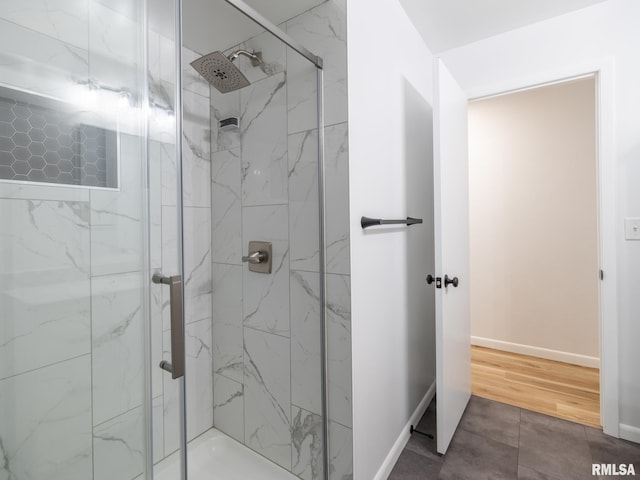 410 Stout Dr, Mackinaw, IL 61755 - full bathroom with a marble finish shower and baseboards
