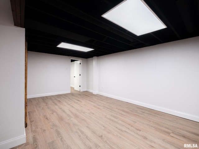410 Stout Dr, Mackinaw, IL 61755 - unfurnished room with wood finished floors and baseboards