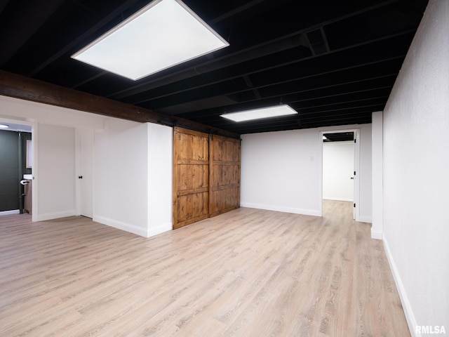 410 Stout Dr, Mackinaw, IL 61755 - finished basement featuring light wood-style floors and baseboards
