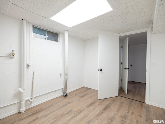 410 Stout Dr, Mackinaw, IL 61755 - finished below grade area with a drop ceiling and light wood-style flooring