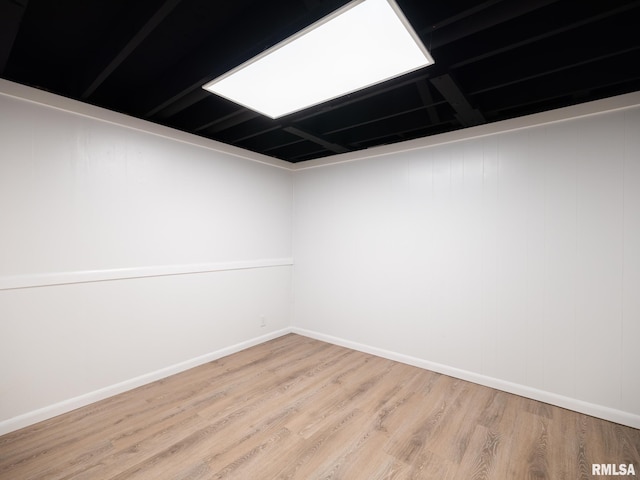 410 Stout Dr, Mackinaw, IL 61755 - empty room with wood finished floors and baseboards