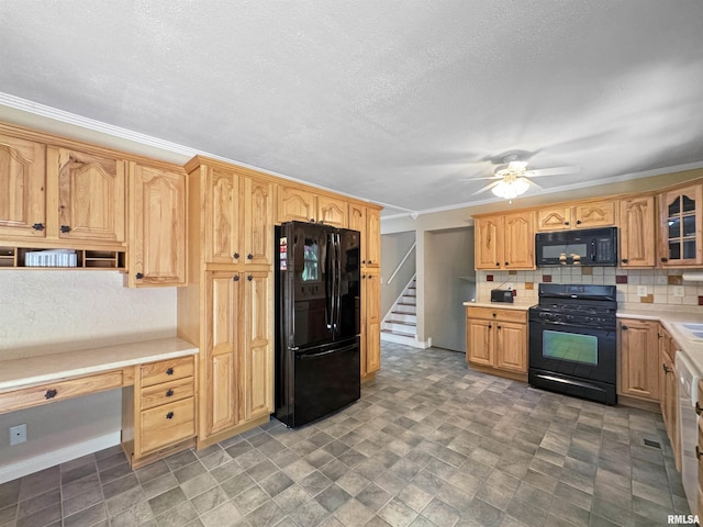 490 Oak Point Rd, Metamora, IL 61548 - kitchen with black appliances, light countertops, decorative backsplash, ceiling fan, and built in desk