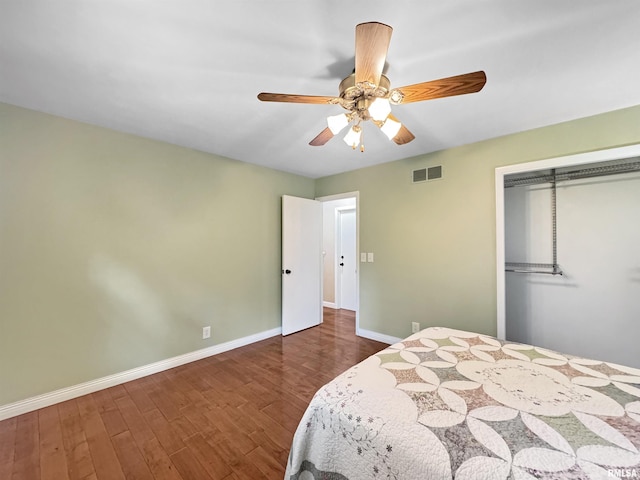 490 Oak Point Rd, Metamora, IL 61548 - bedroom featuring a closet, wood finished floors, and a ceiling fan