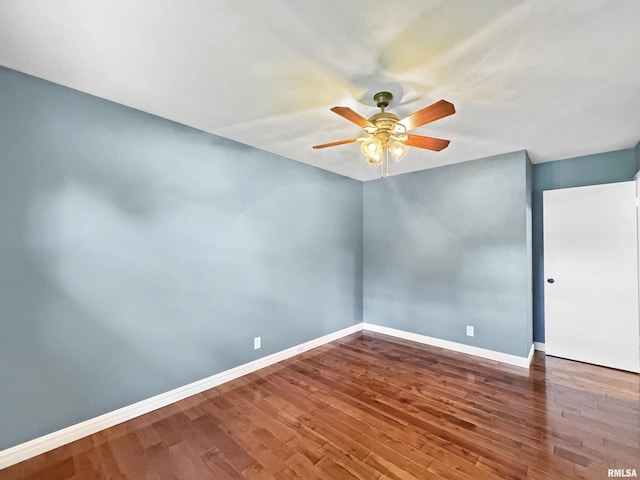 490 Oak Point Rd, Metamora, IL 61548 - empty room featuring ceiling fan and wood finished floors