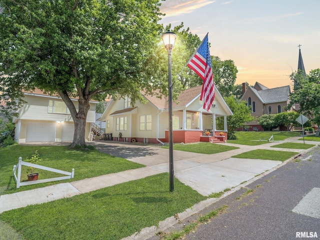 405 Washington St, Pekin, IL 61554 - view of front of home featuring a front yard, concrete driveway, and a garage