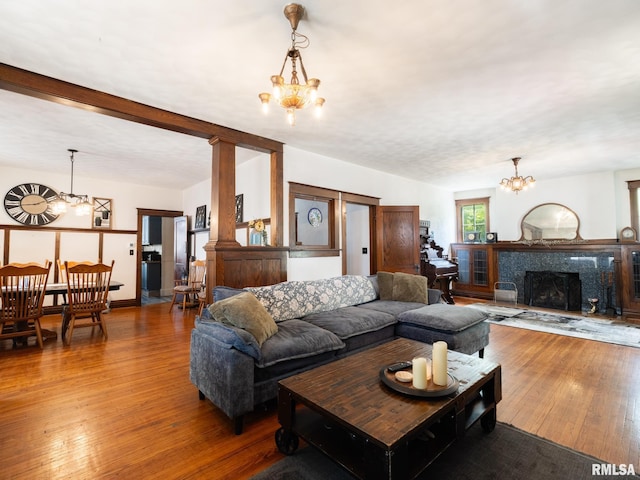 405 Washington St, Pekin, IL 61554 - living room featuring a chandelier, hardwood / wood-style flooring, and a fireplace
