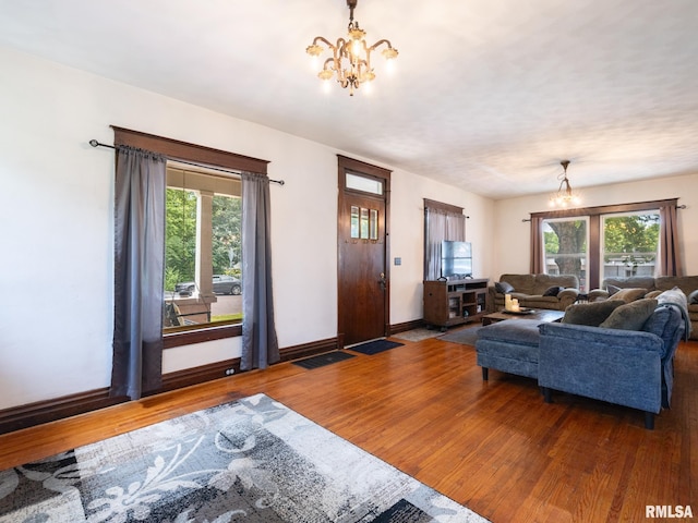 405 Washington St, Pekin, IL 61554 - living room featuring a chandelier and wood finished floors