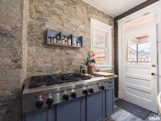405 Washington St, Pekin, IL 61554 - kitchen with stainless steel gas cooktop, blue cabinetry, and wood finished floors