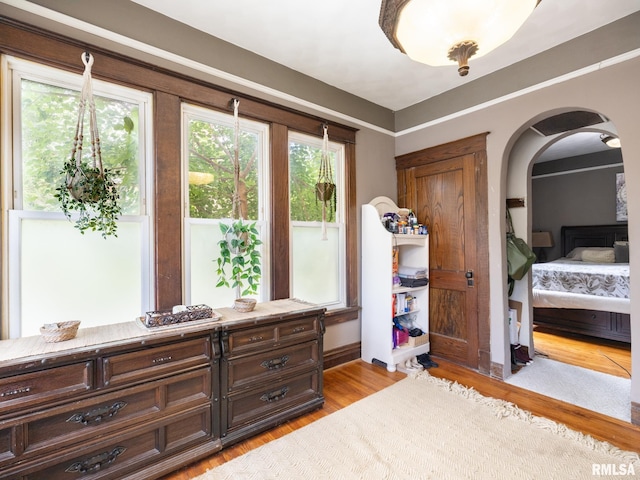 405 Washington St, Pekin, IL 61554 - bedroom with arched walkways and light wood-type flooring