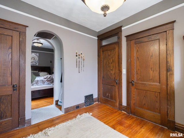 405 Washington St, Pekin, IL 61554 - entrance foyer with light wood-style floors and arched walkways