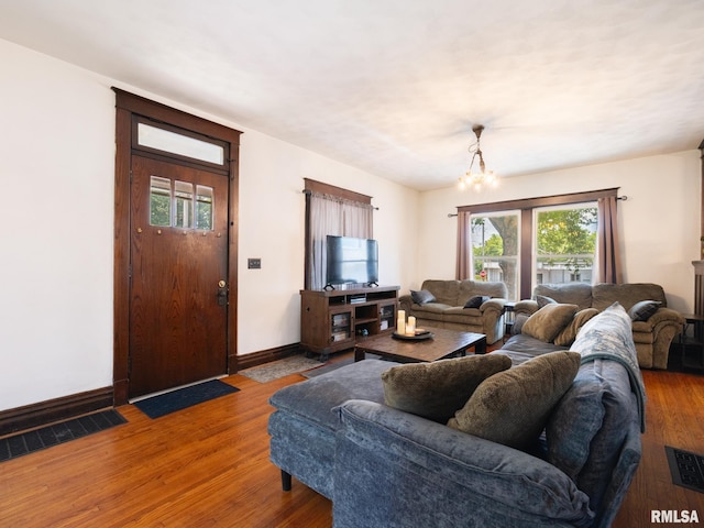 405 Washington St, Pekin, IL 61554 - living room with a chandelier, wood finished floors, and healthy amount of natural light