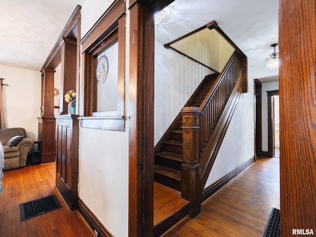 405 Washington St, Pekin, IL 61554 - staircase with wood finished floors and baseboards