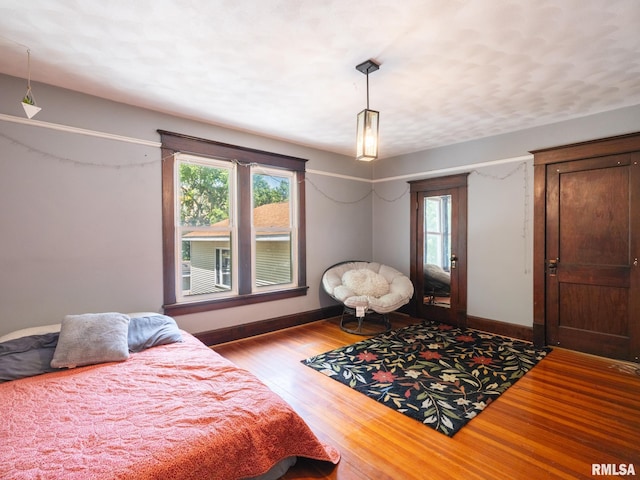 405 Washington St, Pekin, IL 61554 - bedroom with wood finished floors and multiple windows