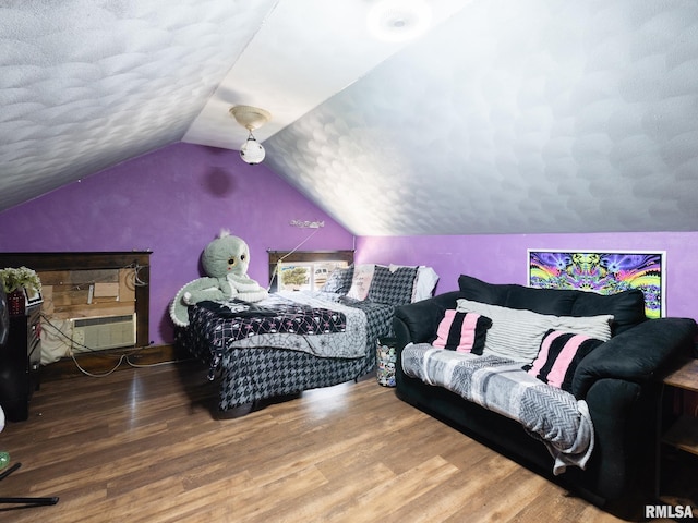 405 Washington St, Pekin, IL 61554 - bedroom with lofted ceiling, wood finished floors, and a textured ceiling