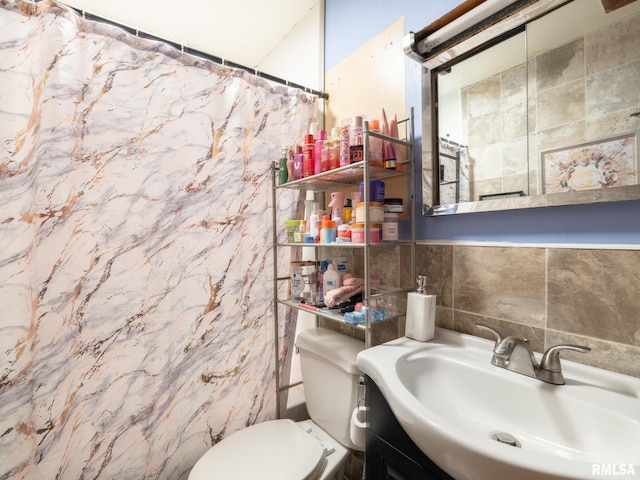 405 Washington St, Pekin, IL 61554 - full bathroom featuring vanity, tile walls, and a shower with shower curtain