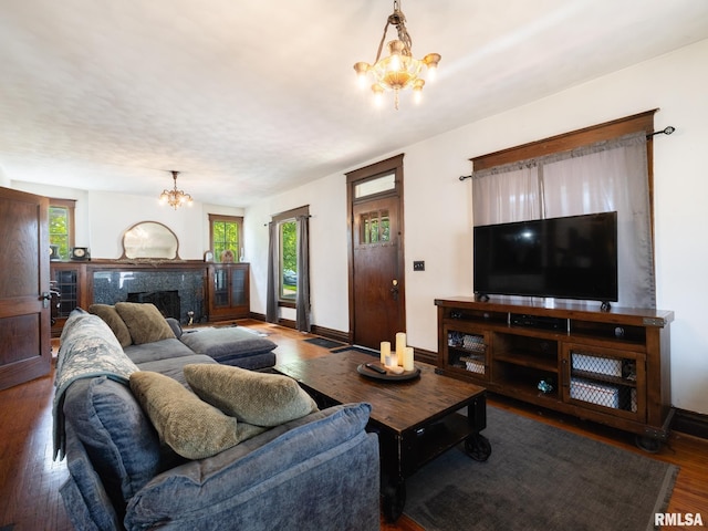 405 Washington St, Pekin, IL 61554 - living room featuring a chandelier, wood finished floors, and a high end fireplace
