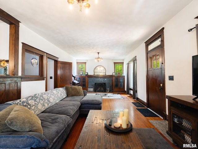 405 Washington St, Pekin, IL 61554 - living room with a chandelier, wood finished floors, and a premium fireplace