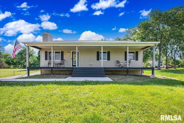 1208 S Adams Rd, Eureka, IL 61530 - view of front of home featuring covered porch, a chimney, and a front lawn