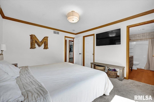 1208 S Adams Rd, Eureka, IL 61530 - carpeted bedroom with crown molding and ensuite bath