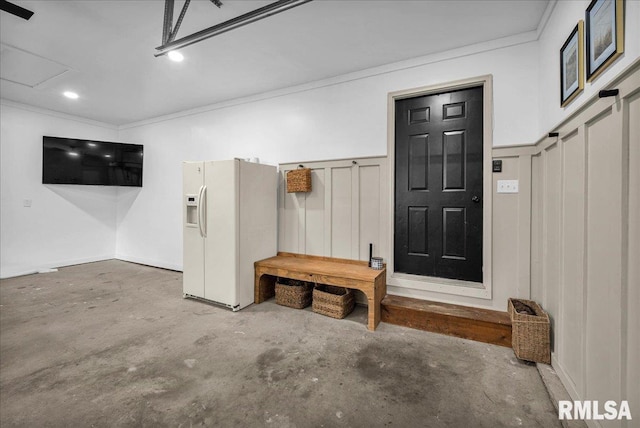 1208 S Adams Rd, Eureka, IL 61530 - garage featuring white refrigerator with ice dispenser