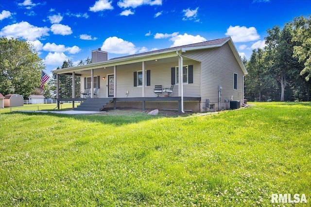 1208 S Adams Rd, Eureka, IL 61530 - view of front of home with a chimney and a front yard