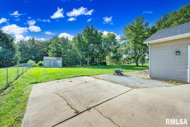1208 S Adams Rd, Eureka, IL 61530 - view of patio with a storage shed and a fire pit