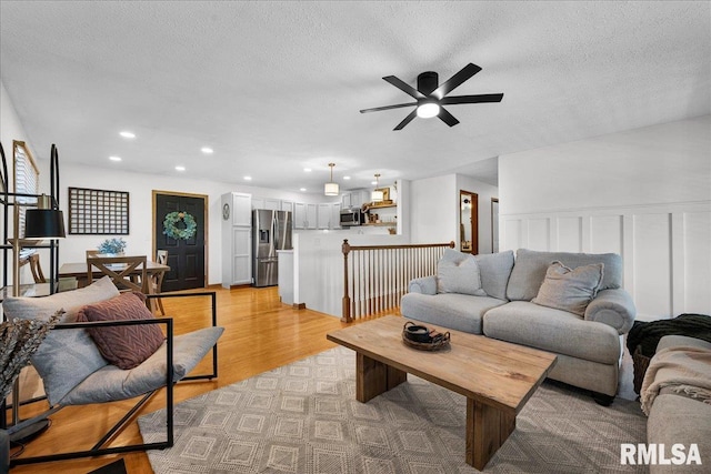 1208 S Adams Rd, Eureka, IL 61530 - living room featuring ceiling fan, light wood-style flooring, recessed lighting, and a textured ceiling
