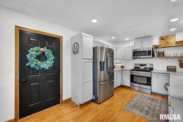 1208 S Adams Rd, Eureka, IL 61530 - kitchen featuring appliances with stainless steel finishes, light wood-style flooring, open shelves, and recessed lighting