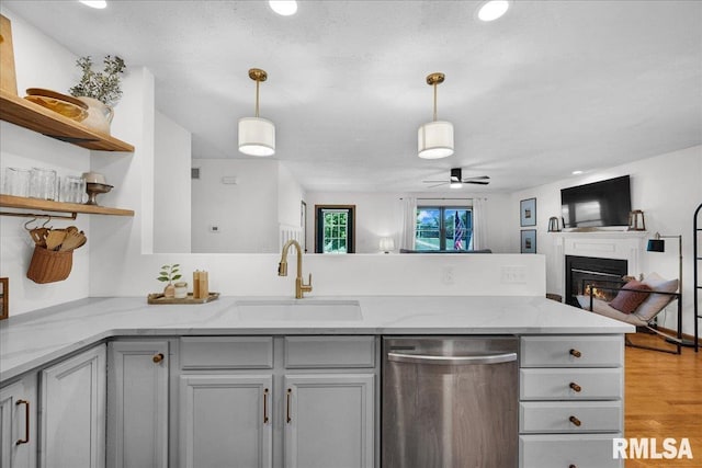 1208 S Adams Rd, Eureka, IL 61530 - kitchen featuring dishwasher, a peninsula, open floor plan, gray cabinets, and ceiling fan
