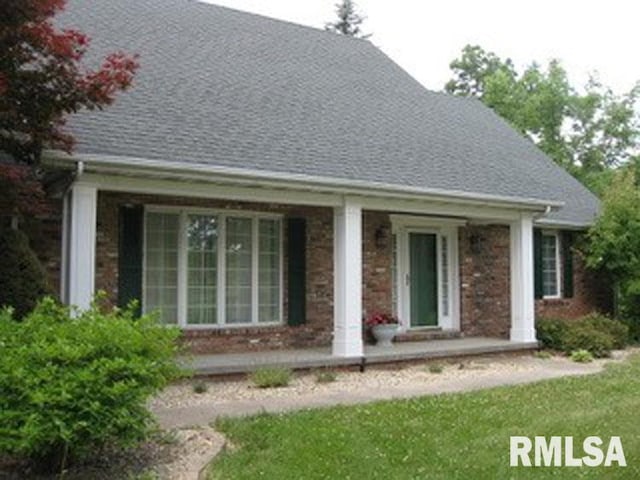 17215 N Mangold Rd, Edelstein, IL 61526 - rear view of property with a porch, roof with shingles, and brick siding