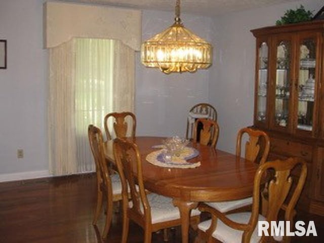 17215 N Mangold Rd, Edelstein, IL 61526 - dining room with a chandelier and wood finished floors