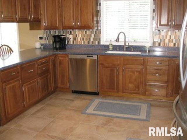 17215 N Mangold Rd, Edelstein, IL 61526 - kitchen featuring appliances with stainless steel finishes, brown cabinets, and dark countertops