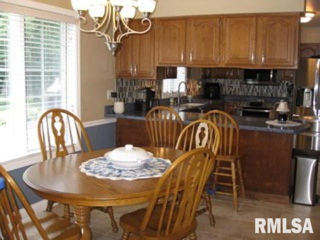 17215 N Mangold Rd, Edelstein, IL 61526 - dining space with a chandelier