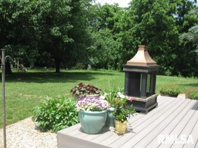 17215 N Mangold Rd, Edelstein, IL 61526 - wooden deck featuring a yard