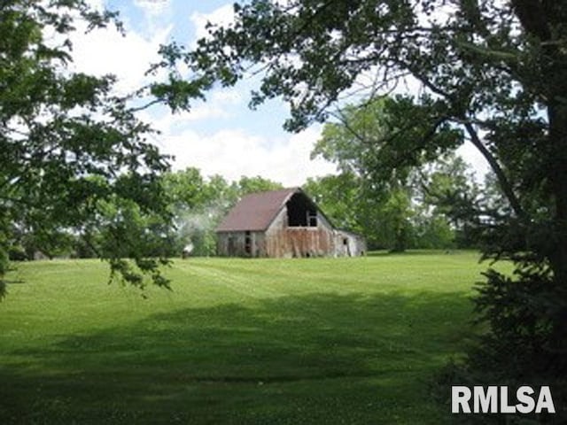 17215 N Mangold Rd, Edelstein, IL 61526 - view of green lawn with a barn and an outbuilding
