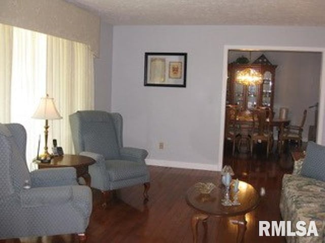 17215 N Mangold Rd, Edelstein, IL 61526 - sitting room featuring wood finished floors, healthy amount of natural light, and a textured ceiling