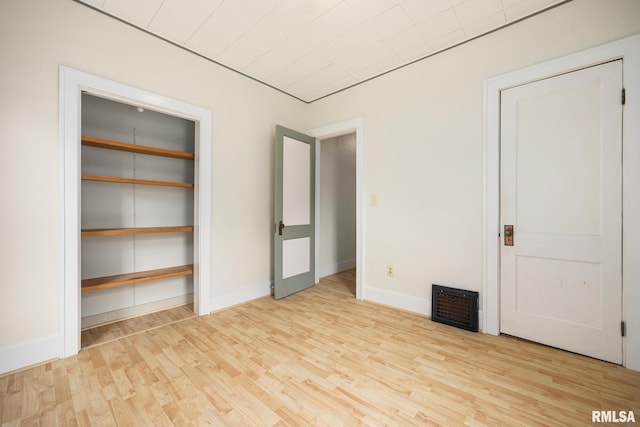 2017 W Laura Ave, West Peoria, IL 61604 - unfurnished bedroom featuring wood finished floors and baseboards