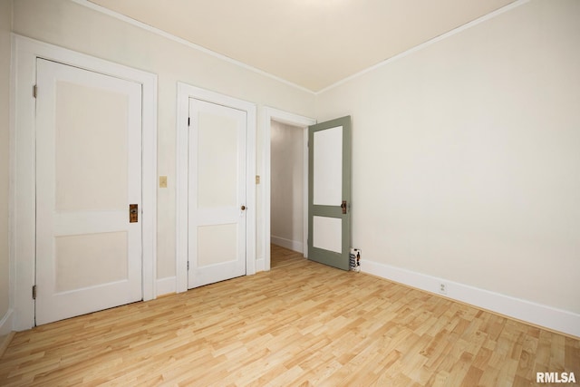 2017 W Laura Ave, West Peoria, IL 61604 - unfurnished bedroom with wood finished floors and ornamental molding