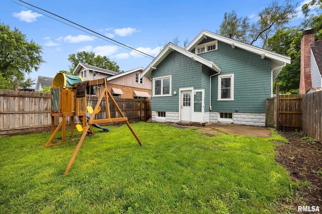 2017 W Laura Ave, West Peoria, IL 61604 - back of property featuring a playground and a fenced backyard