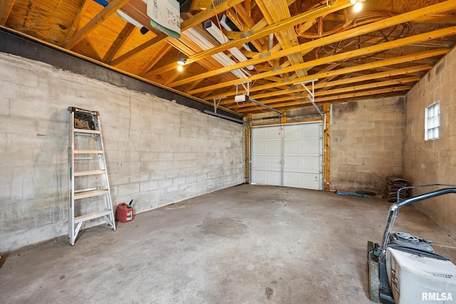 2017 W Laura Ave, West Peoria, IL 61604 - garage with a garage door opener and concrete block wall