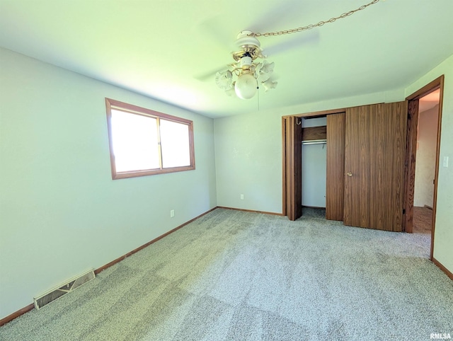6646 Mason Rd, Manito, IL 61546 - unfurnished bedroom with a closet, carpet, and ceiling fan