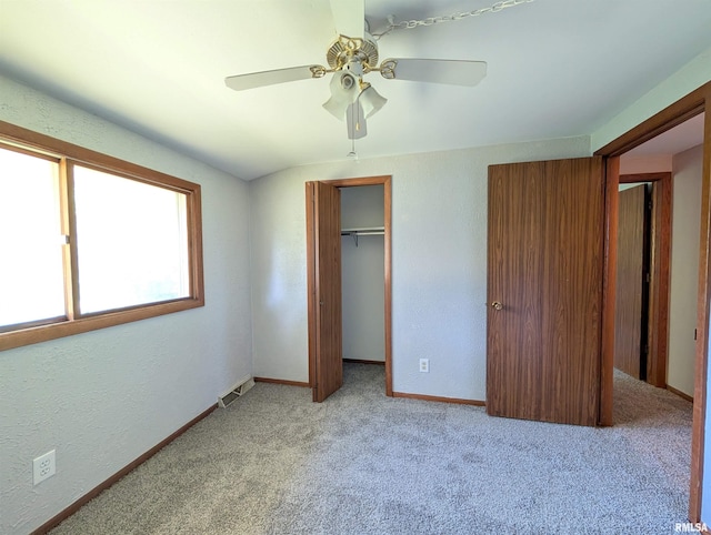 6646 Mason Rd, Manito, IL 61546 - unfurnished bedroom with carpet, a textured wall, a ceiling fan, and a closet