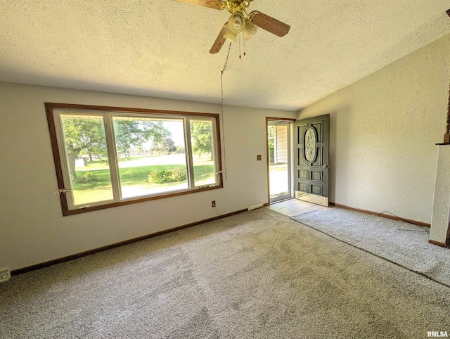 6646 Mason Rd, Manito, IL 61546 - unfurnished room with a textured ceiling, light colored carpet, a ceiling fan, and a textured wall