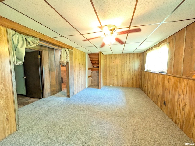 6646 Mason Rd, Manito, IL 61546 - unfurnished room featuring carpet, wooden walls, a paneled ceiling, and ceiling fan