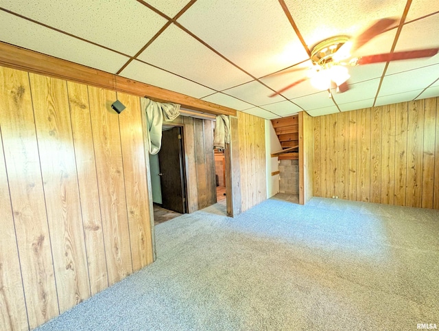 6646 Mason Rd, Manito, IL 61546 - carpeted spare room featuring a paneled ceiling and wooden walls