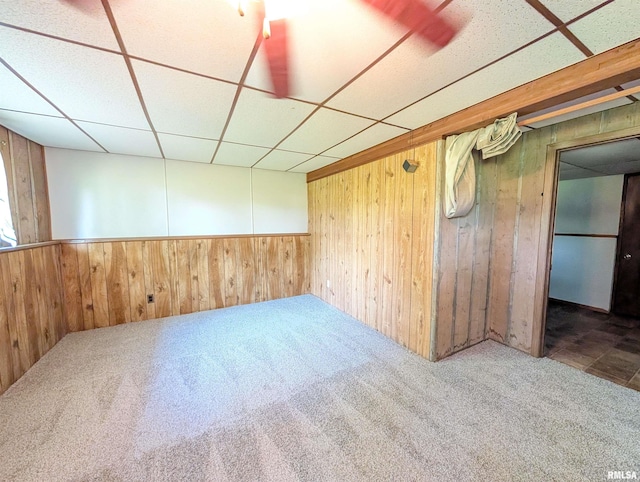 6646 Mason Rd, Manito, IL 61546 - carpeted spare room with wood walls, a drop ceiling, and wainscoting