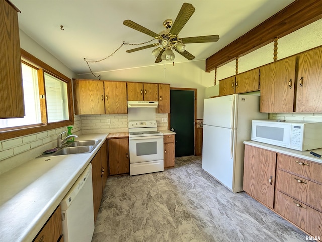 6646 Mason Rd, Manito, IL 61546 - kitchen with white appliances, under cabinet range hood, backsplash, vaulted ceiling, and light countertops