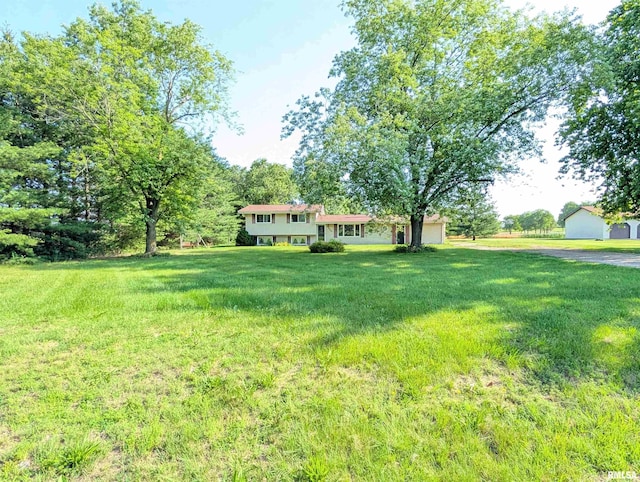 6646 Mason Rd, Manito, IL 61546 - view of green lawn featuring a garage